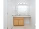 Bathroom featuring a vanity with neutral countertop and a large mirror with Hollywood-style lighting at 117 Renee Dr, Smithfield, NC 27577
