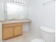 Bathroom featuring a vanity with neutral countertop and a large mirror plus a toilet at 117 Renee Dr, Smithfield, NC 27577