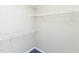 This is a walk-in closet featuring white metal shelving and neutral-painted walls at 117 Renee Dr, Smithfield, NC 27577