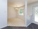 Bright dining room with chandelier and patterned vinyl flooring at 117 Renee Dr, Smithfield, NC 27577