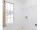 Bright laundry room features a window and appliance hookups at 117 Renee Dr, Smithfield, NC 27577