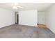 Spacious living room with neutral carpet, white walls, and a ceiling fan at 117 Renee Dr, Smithfield, NC 27577