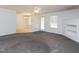 Open-concept living area with a view into the dining room and ample natural light at 117 Renee Dr, Smithfield, NC 27577