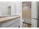 Bright bathroom featuring a vanity with a sink, tiled countertop and a tub with tiled wall at 120 Polks Landing Rd, Chapel Hill, NC 27516