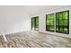 Bedroom featuring vinyl floors, bright light, and sliding door to private deck at 120 Polks Landing Rd, Chapel Hill, NC 27516