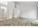 Spacious bedroom with unique wood floors and loft access, creating a cozy and inviting atmosphere at 120 Polks Landing Rd, Chapel Hill, NC 27516