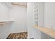Organized walk-in closet with built-in shelving and hanging rods for ample storage at 120 Polks Landing Rd, Chapel Hill, NC 27516