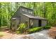 Charming home nestled in a serene wooded setting with lush greenery and a unique architectural design at 120 Polks Landing Rd, Chapel Hill, NC 27516