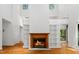 Bright living room boasting built in shelving, a fireplace and vaulted ceilings at 120 Polks Landing Rd, Chapel Hill, NC 27516