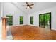 Living room featuring parquet floors, fireplace, sliding doors and plenty of natural light at 120 Polks Landing Rd, Chapel Hill, NC 27516