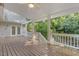 Enjoy this covered wooden back deck, perfect for entertaining or relaxing with Gathering and friends at 122 N Fern Abbey Ln, Cary, NC 27518