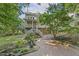 This brick patio and mulched landscaping add extra enjoyment to the large backyard and deck at 122 N Fern Abbey Ln, Cary, NC 27518