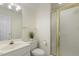 Bathroom featuring a sink, toilet, and shower with a gold frame at 122 N Fern Abbey Ln, Cary, NC 27518