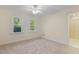 This bedroom is bathed in natural light with 2 windows and neutral carpeting at 122 N Fern Abbey Ln, Cary, NC 27518