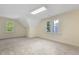 Spacious bonus room with two windows providing lots of natural light and neutral carpeting at 122 N Fern Abbey Ln, Cary, NC 27518