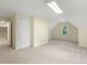 Spacious bonus room featuring neutral carpeting, light colored walls, and a storage nook at 122 N Fern Abbey Ln, Cary, NC 27518