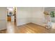Dining room with hardwood floors, crown molding, and natural light from the windows at 122 N Fern Abbey Ln, Cary, NC 27518
