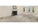 Spacious living room featuring a fireplace and large windows for natural light at 122 N Fern Abbey Ln, Cary, NC 27518