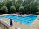 Community pool with lap lanes, lounge chairs, and a spacious sun deck at 122 N Fern Abbey Ln, Cary, NC 27518