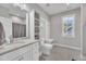 Bathroom featuring a sink, toilet, storage and a window at 1230 S 2Nd St, Smithfield, NC 27577