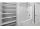 Clean bathroom with a bathtub, shower, and shelving at 1230 S 2Nd St, Smithfield, NC 27577