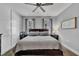 Cozy bedroom featuring a ceiling fan, bedside tables, and a comfortable bed at 1230 S 2Nd St, Smithfield, NC 27577