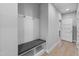 Hallway with built in storage bench with hooks and overhead storage at 1230 S 2Nd St, Smithfield, NC 27577