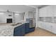 Open kitchen with granite countertops, stainless steel appliances, and ample cabinet space at 1230 S 2Nd St, Smithfield, NC 27577