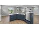 Open concept kitchen boasts granite countertops, stainless appliances, and eat-in breakfast bar at 1230 S 2Nd St, Smithfield, NC 27577