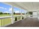 Large porch with a swing overlooking a neighborhood at 1230 S 2Nd St, Smithfield, NC 27577