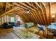 Spacious unfinished attic area with exposed wooden beams, offering potential for custom design at 128 Shadowbrook, Pittsboro, NC 27312