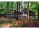 Secluded backyard with large deck and lush greenery at 128 Shadowbrook, Pittsboro, NC 27312