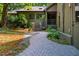 Front entrance of home featuring landscaping, brick sidewalk and wooden staircase at 128 Shadowbrook, Pittsboro, NC 27312