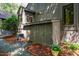Back of home featuring outdoor storage and landscaping at 128 Shadowbrook, Pittsboro, NC 27312
