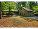 This gorgeous home is surrounded by a lush forest and is equipped with an attached two car garage at 128 Shadowbrook, Pittsboro, NC 27312