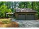 This home offers ample parking with an attached two car garage and lush surrounding forest at 128 Shadowbrook, Pittsboro, NC 27312
