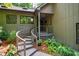 Inviting front entrance with a curved walkway and landscaped garden at 128 Shadowbrook, Pittsboro, NC 27312