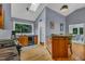 Open-concept kitchen with wooden floors and natural light at 128 Shadowbrook, Pittsboro, NC 27312