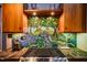 Unique kitchen backsplash over stainless steel stove at 128 Shadowbrook, Pittsboro, NC 27312
