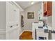 Functional laundry room with ample storage and utility sink at 128 Shadowbrook, Pittsboro, NC 27312