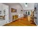 Open living area with skylight, light-colored walls, and wood floors leads to an outdoor deck at 128 Shadowbrook, Pittsboro, NC 27312