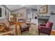 Comfortable living room with fireplace, built-in shelving, and plentiful seating area at 128 Shadowbrook, Pittsboro, NC 27312