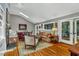 Open living space boasts wood floors, cathedral ceiling, and access to the outdoors at 128 Shadowbrook, Pittsboro, NC 27312