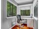 Bright office nook with a wooded view and a desk for work at 128 Shadowbrook, Pittsboro, NC 27312