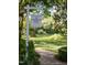 Elegant sign for Fearrington House Dinner, guiding guests along a scenic brick path through lush greenery at 128 Shadowbrook, Pittsboro, NC 27312