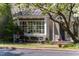 Charming bookstore exterior with a large window display and inviting entrance, nestled in a quaint village setting at 128 Shadowbrook, Pittsboro, NC 27312