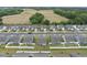 An elevated shot of a well-maintained residential area, showing homes, backyards and green spaces at 129 Alumroot Rd, Holly Springs, NC 27540