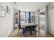A sunlit dining area with stylish furnishings and sliding glass doors to a patio, ideal for gatherings at 129 Alumroot Rd, Holly Springs, NC 27540