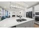 Bright and open kitchen with island, showcasing the home's modern design and seamless flow at 129 Alumroot Rd, Holly Springs, NC 27540