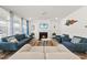 Inviting living room with a cozy fireplace and stylish decor, creating a welcoming atmosphere at 129 Alumroot Rd, Holly Springs, NC 27540